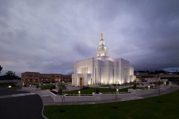 Illuminated temple architecture under cloudy sky in Guatemala