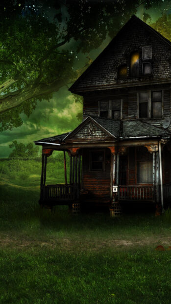 Old haunted house with eerie green sky and large tree in a spooky landscape