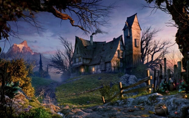 A haunted house with lit windows surrounded by barren trees and an eerie landscape at dusk