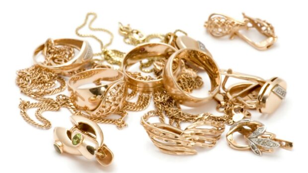 A collection of golden jewelry including rings and chains showcasing exquisite jewels craftsmanship