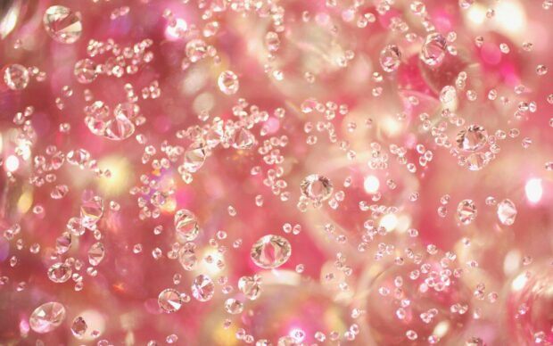 Sparkling jewels glittering in pink light with high detail and vibrant colors