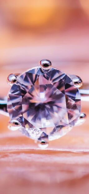 A close up of a precious jewel with intricate details and sparkling facets