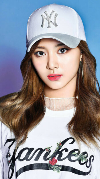 A close up of K Pop girl wearing a white Yankees cap and shirt in HD quality