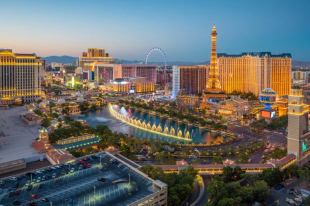 A vibrant view of Las Vegas Strip featuring iconic landmarks and lively evening lights
