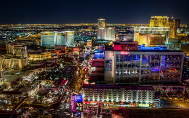 Night view of Las Vegas Strip with illuminated hotels and casinos in the cityscape