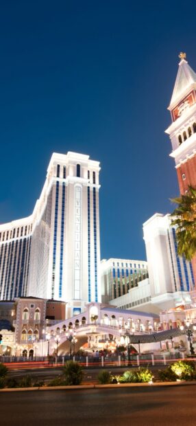 The Venetian hotel and casino on the Las Vegas Strip at night with clear skies