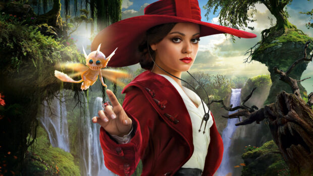 Mila Kunis wearing a red hat and coat with a fantasy creature in a waterfall landscape