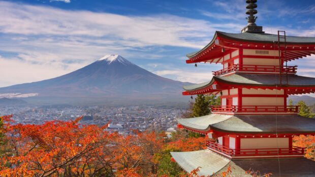 Traditional Japanese pagoda with Mount Fuji Japan in the background during autumn