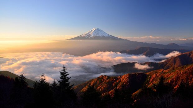 Scenic view of Mount Fuji Japan surrounded by autumn forest and morning clouds