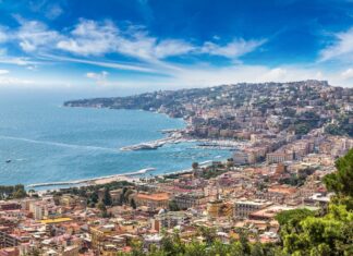 A panoramic view of Naples cityscape with coastal hills and a vibrant urban area