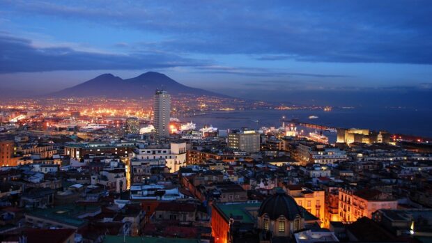 Evening cityscape of Naples with Mount Vesuvius in the background