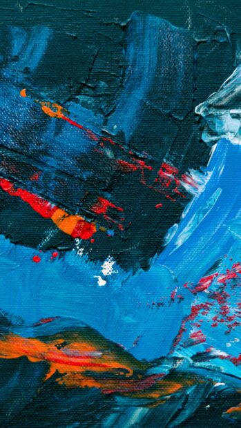 Abstract paint strokes in blue and orange on canvas texture