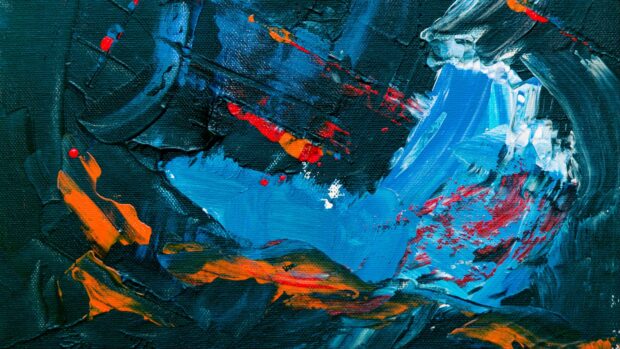 Abstract paint strokes featuring vibrant blue and orange textures on a canvas