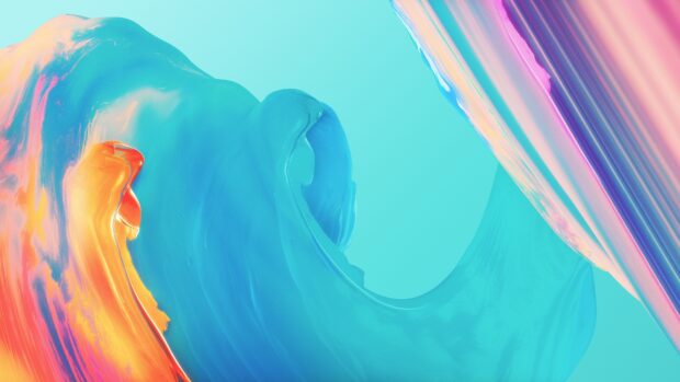Abstract paint swirl with vibrant blue orange and pink colors on a smooth surface