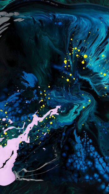 Abstract paint splashes in blue and pink forming fluid patterns with yellow dots