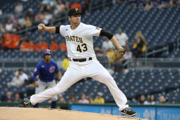 Pittsburgh Pirates pitcher delivering a pitch during a professional baseball game