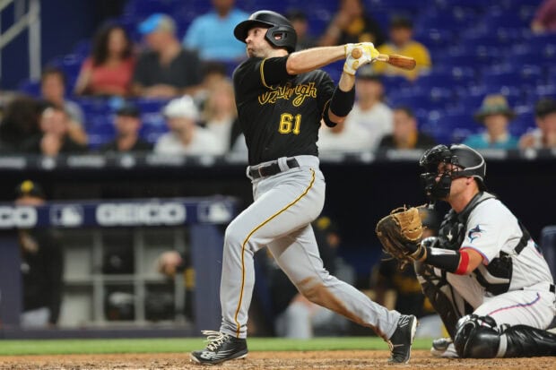 Pittsburgh Pirates player hitting a baseball during a professional game at the stadium