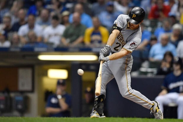 Pittsburgh Pirates player hitting the ball during a baseball game at the stadium