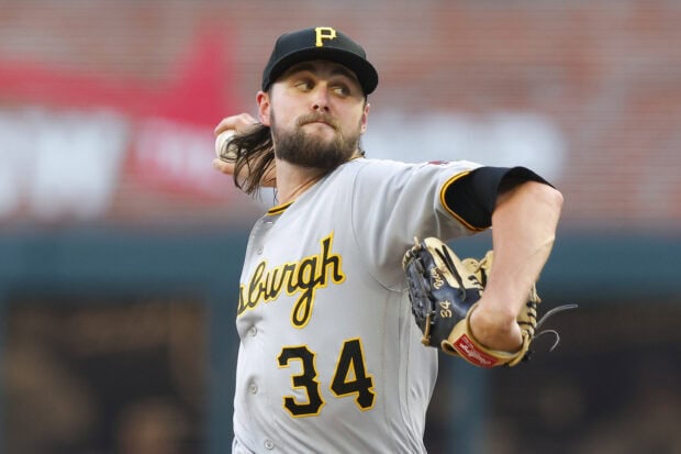 Pittsburgh Pirates player wearing jersey number 34 pitching on the field
