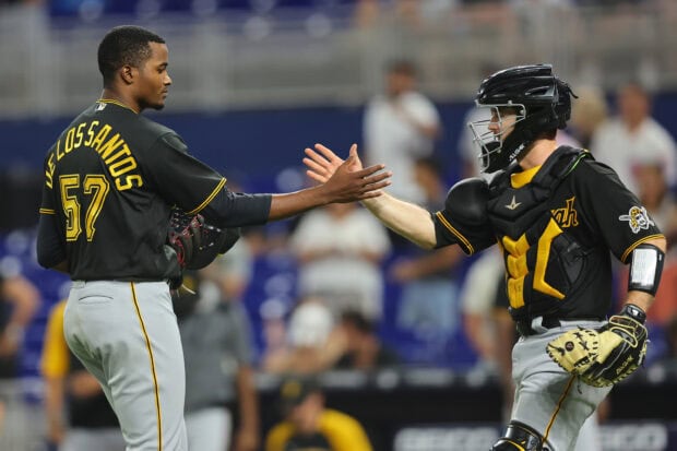 Pittsburgh Pirates players celebrating during a baseball game in Pittsburgh Pirates uniforms