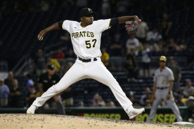 A Pittsburgh Pirates player pitching during a baseball game on the mound