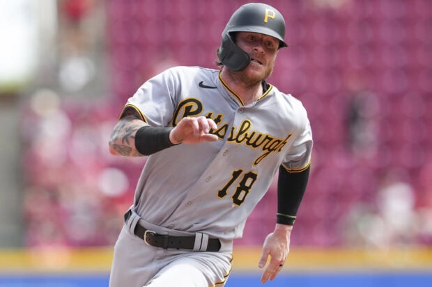 A Pittsburgh Pirates player running on the field during a baseball game in action