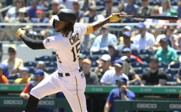 Baseball player Cruz swinging bat in Pittsburgh Pirates uniform at a professional game
