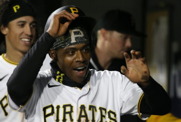 A Pittsburgh Pirates player celebrating with teammates during a game in high quality 2K resolution