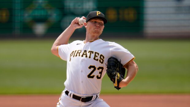 A Pittsburgh Pirates player wearing number 23 pitching the baseball during a game