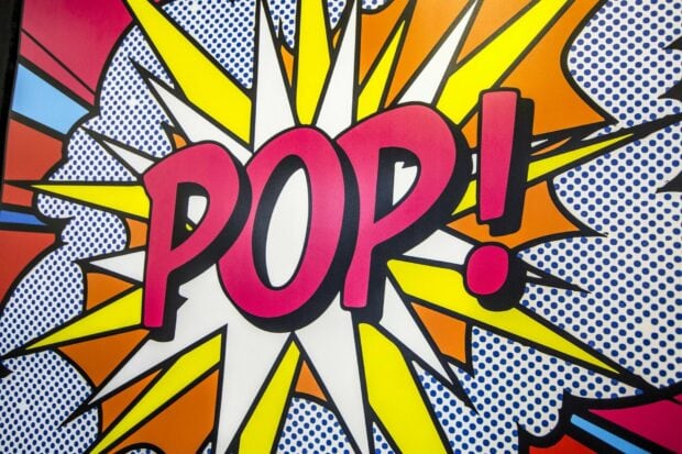 Colorful pop art comic style explosion with the word pop in bold letters