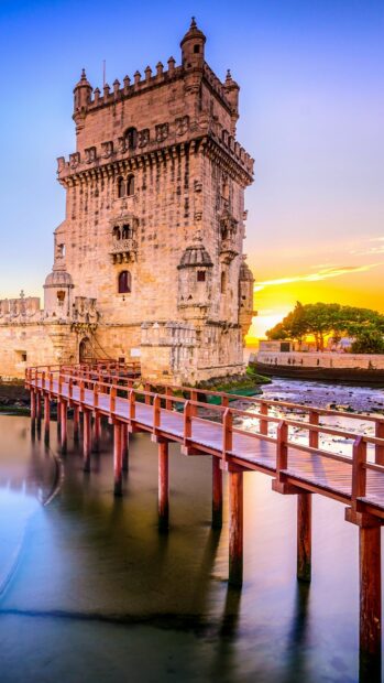 Ancient fortress in Portugal with wooden bridge during sunset showing stunning architecture