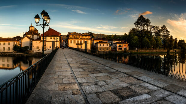 Historic Portugal street with traditional buildings lit by sunset light