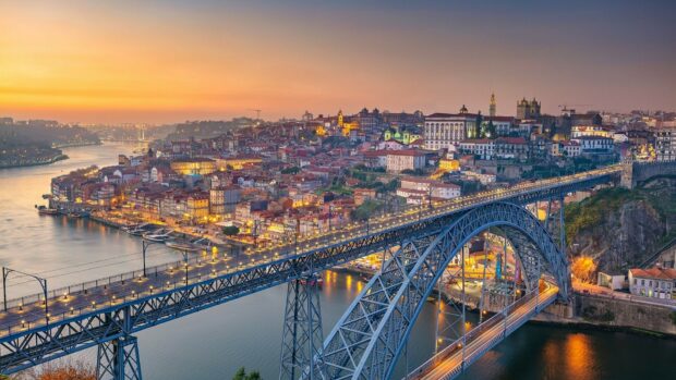 Porto cityscape with river and historic district at sunset in Portugal