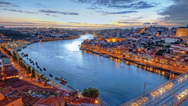 Beautiful Portugal cityscape with river and historic buildings at sunset