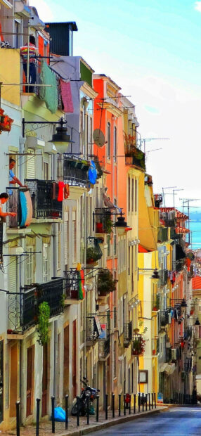 Colorful Portugal street with traditional architecture and vibrant buildings lining the hill