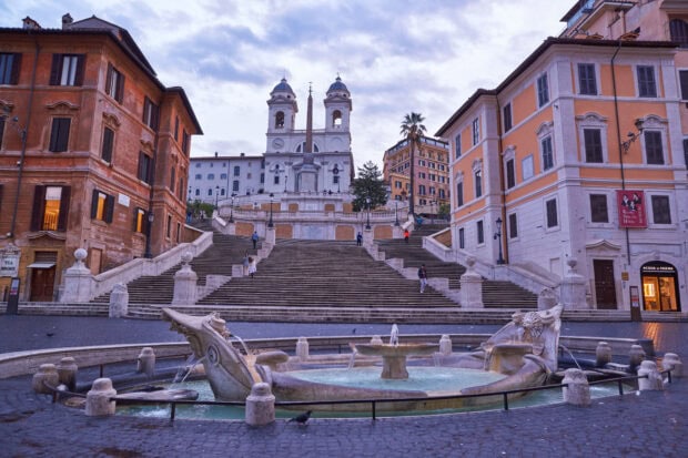 Architectural details of Spanish Steps Rome with historic buildings and fountain in view