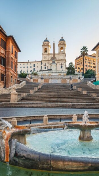 Spanish Steps Rome Wallpapers HD Mobile A historic view of the Spanish Steps with a fountain in front and classic Roman buildings surrounding the area