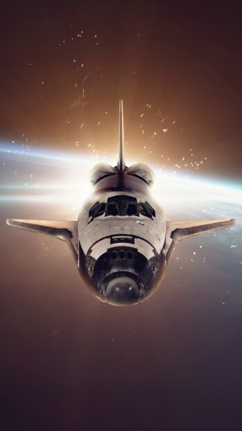 Space shuttle starship flying above the earth with glowing sparks around