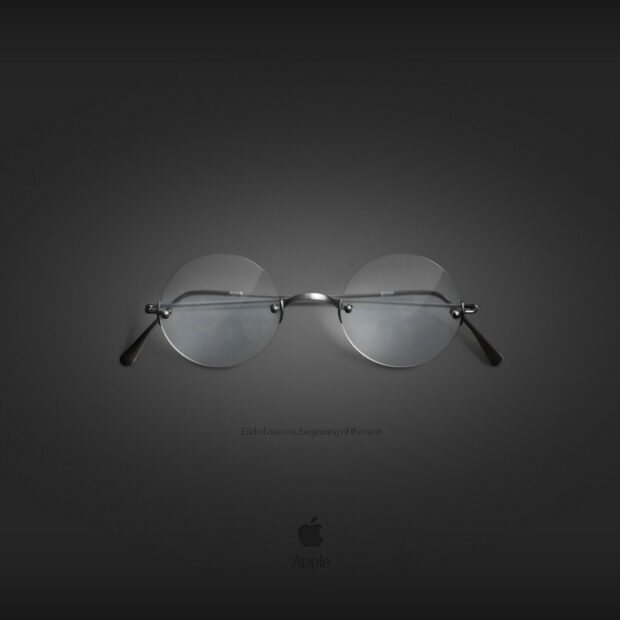 Steve Jobs round glasses on a dark background symbolizing Steve Jobs essence