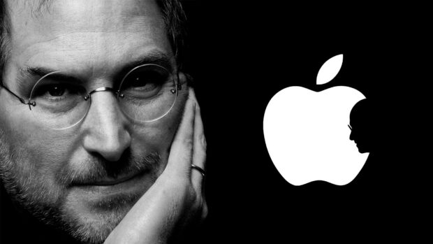 Close up of Steve Jobs thoughtful face with Apple logo silhouette on black background