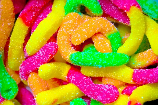 Colorful gummy candies covered with sugar crystals close up sweets