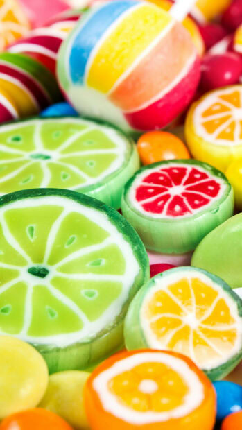 Colorful citrus fruit sweets with vibrant striped patterns and detailed textures