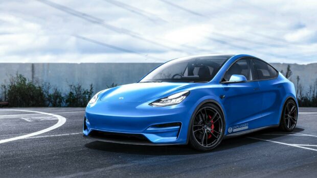 Blue Tesla Model Y parked on asphalt in an outdoor setting with a cloudy sky