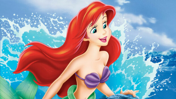 Ariel with flowing red hair smiling by the ocean waves in a classic mermaid scene