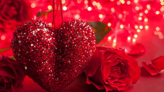 A sparkling red heart decoration with roses in a romantic Valentine setting