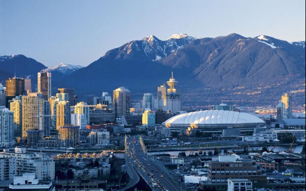 Scenic Vancouver Canada cityscape with mountains in the background during sunset
