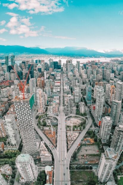 Aerial view of Vancouver cityscape with urban buildings and highway in Canada