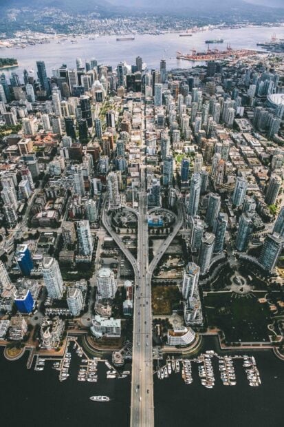 Aerial view of downtown Vancouver Canada with highways and marina in clear weather