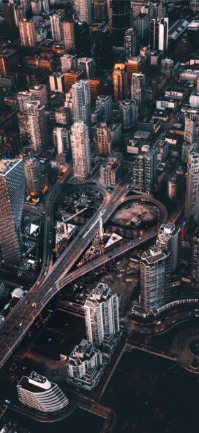 Aerial view of downtown Vancouver Canada cityscape at dusk with highway and buildings
