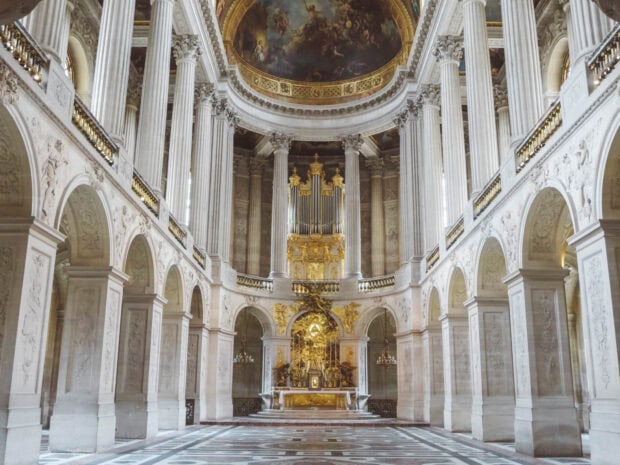 Interior view of Versailles with grand architecture and ornate decorations displayed